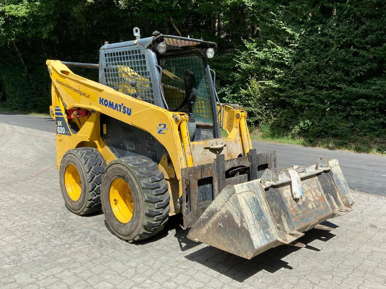 4-57-4.webp Baustellen-Kompaktlader KOMATSU SK 820 – 2012 (Professionelle geländegängige Ausrüstung) – Bild 1